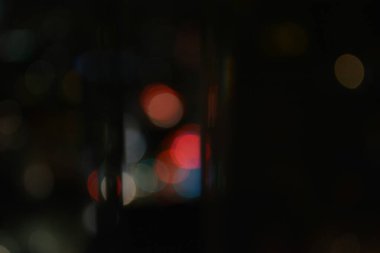 Beautiful Night Life bokeh. Everyday Night life Realistic and organic rainbow bokeh soft light background. shiny soft light bokeh abstract background overlay video. Realistic camera organic light leaks bokeh overlay background.