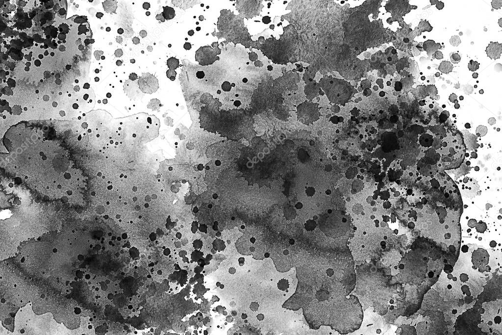 Black and white water color splash over a white canvas or textured paper. Ink drops. Paint splash, grunge liquid drop splashes, abstract artistic ink splatter. Black ink splashes on a white background