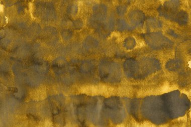 Altın Mürekkep desenli arka plan. Kağıt bir tuval üzerinde yumuşak altın su mürekkebi. Soyut altın parıltılı desenli sanat illüstrasyonu. Soyut sanat, ödüller, konser, sunum, grafik tasarım ve daha fazlası için arkaplan.