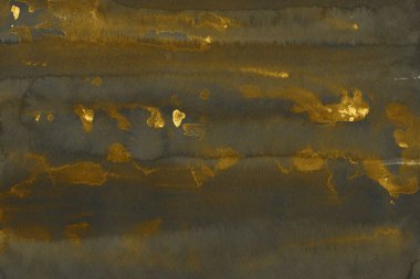 Altın Mürekkep desenli arka plan. Kağıt bir tuval üzerinde yumuşak altın su mürekkebi. Soyut altın parıltılı desenli sanat illüstrasyonu. Soyut sanat, ödüller, konser, sunum, grafik tasarımı ve daha fazlası için zemin.