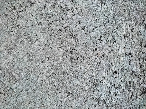 grungy grey concrete surface, rocky texture, full frame for copy space