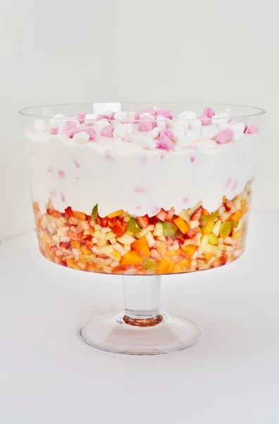 Marshmallows in cream over fruit salad — Stock Photo, Image