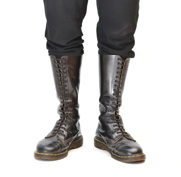 Pair of knee-high 20 eyelet black lace-up boots — Stock Photo, Image