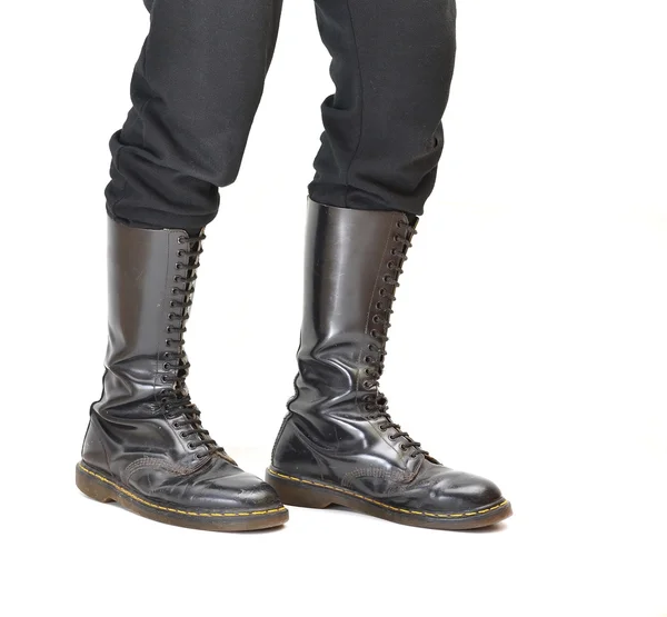 Pair of knee-high 20 eyelet black lace-up boots — Stock Photo, Image