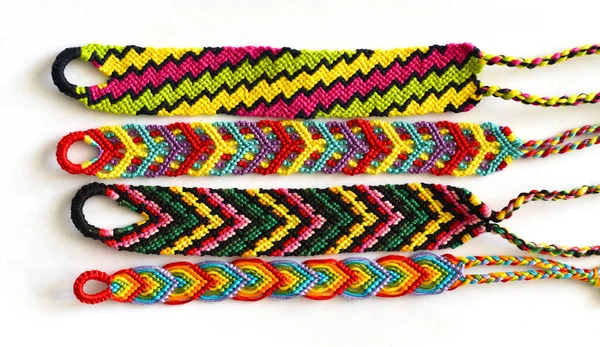 DIY woven friendship bracelets with different braiding. Summer accessory