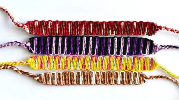 DIY woven friendship bracelets with straight braiding. Summer accessory