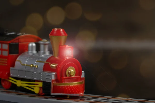 Toy Christmas Locomotive Background Garland Bokeh Lights Concept Celebrating Christmas — Stock Photo, Image