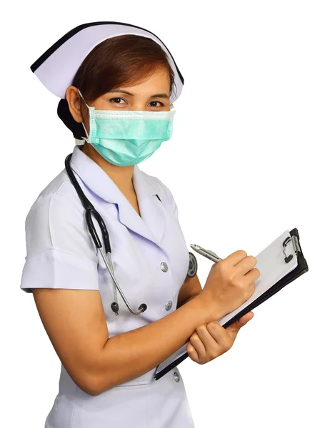 Asiatiska kvinnlig sjuksköterska skriva medicinsk rapport på vit bakgrund med urklippsbana — Stockfoto
