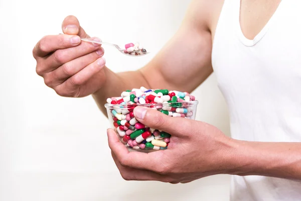 Using a spoon  the medicine in cup to eat. — Stock Photo, Image