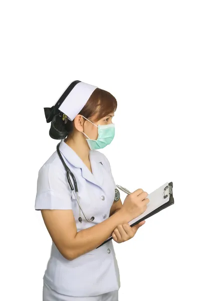 Asiatiska kvinnlig sjuksköterska skriva medicinsk rapport på vit bakgrund med urklippsbana — Stockfoto