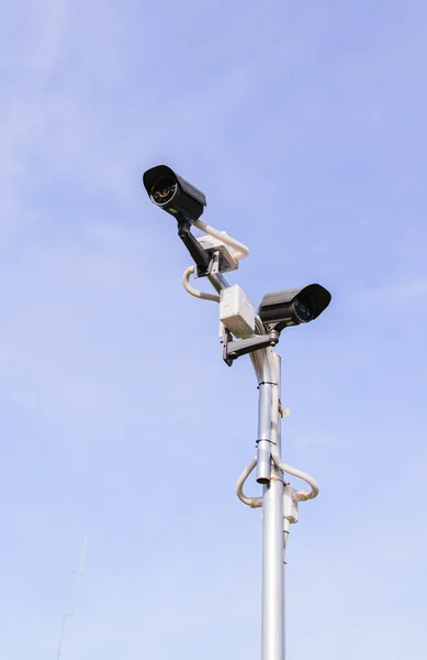 CCTV security camera on  blue sky — Stock Photo, Image