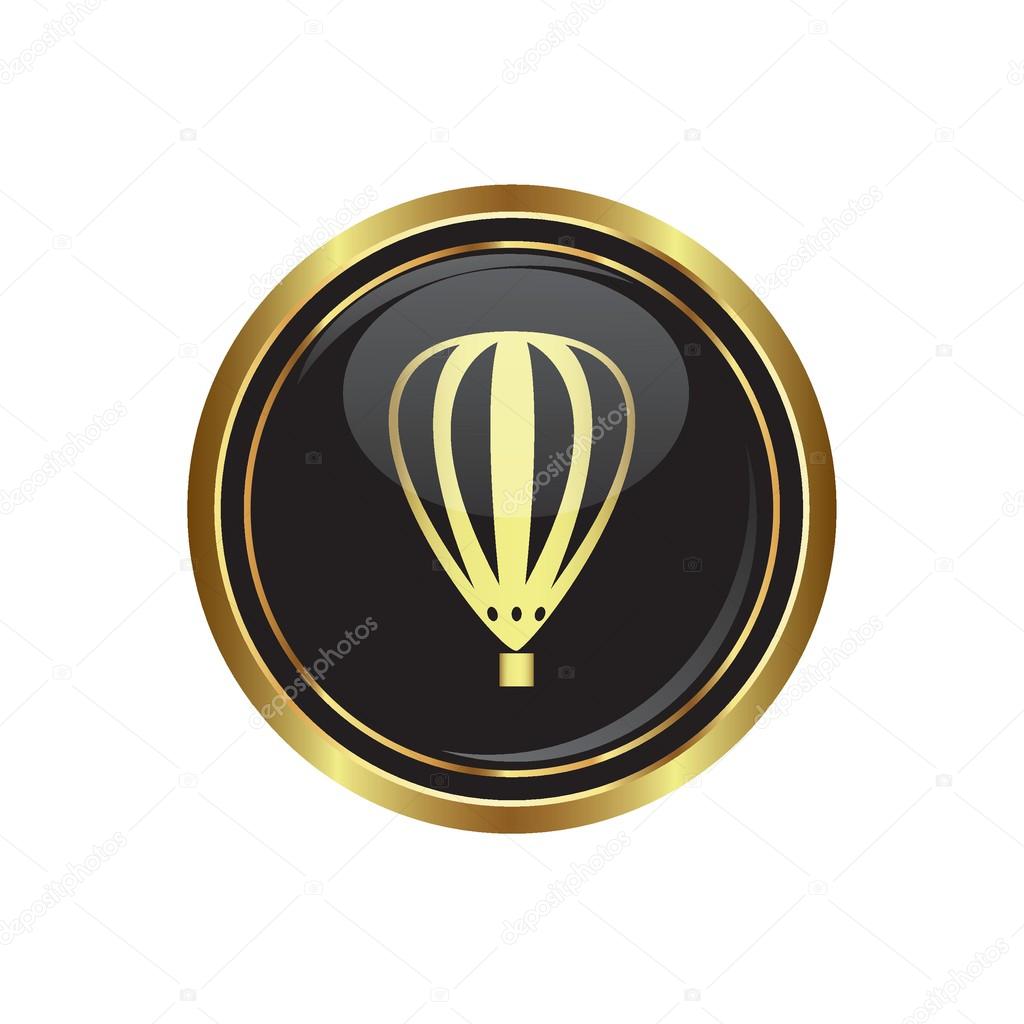 Round golden button with hot air balloon icon