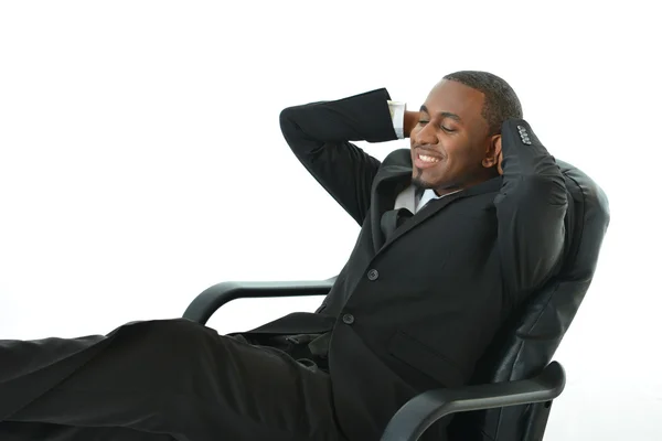 Empresário inclinado para trás na cadeira e dormindo — Fotografia de Stock