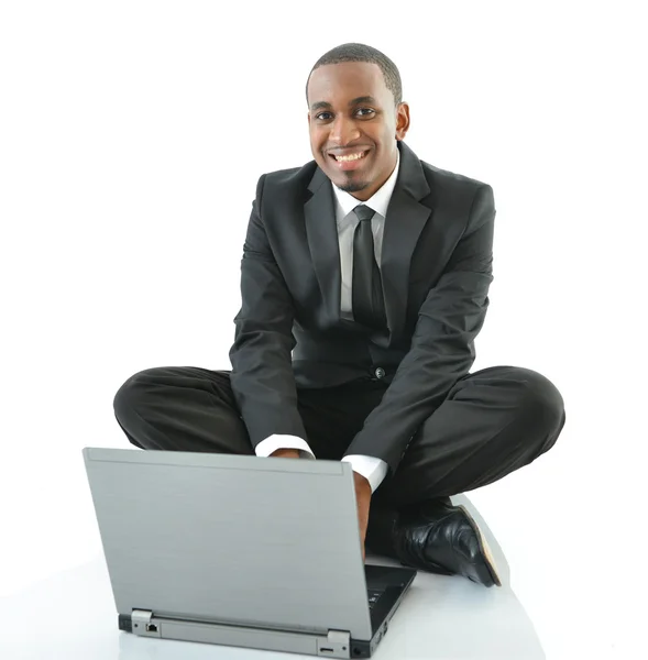 Businessman working on laptop sitting on floor — Stock Photo, Image