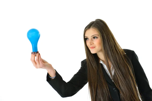 青色の電球を保持している女性実業家 ストック画像