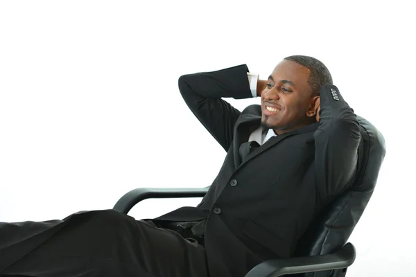 Businessman leaning back in the chair Royalty Free Stock Photos