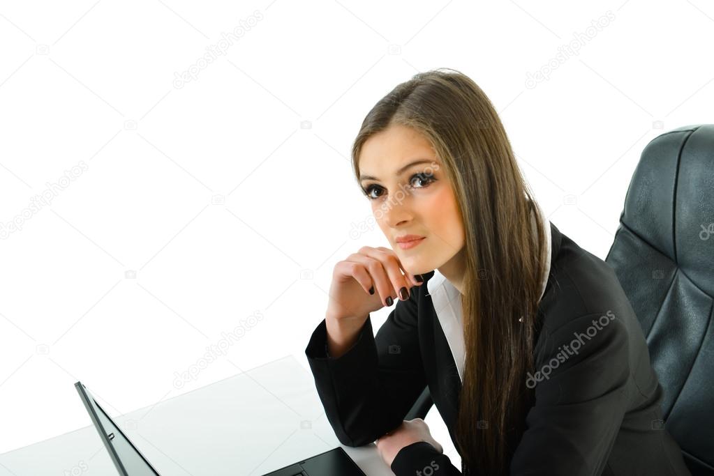 Business Woman Thinking while sitting at her desk