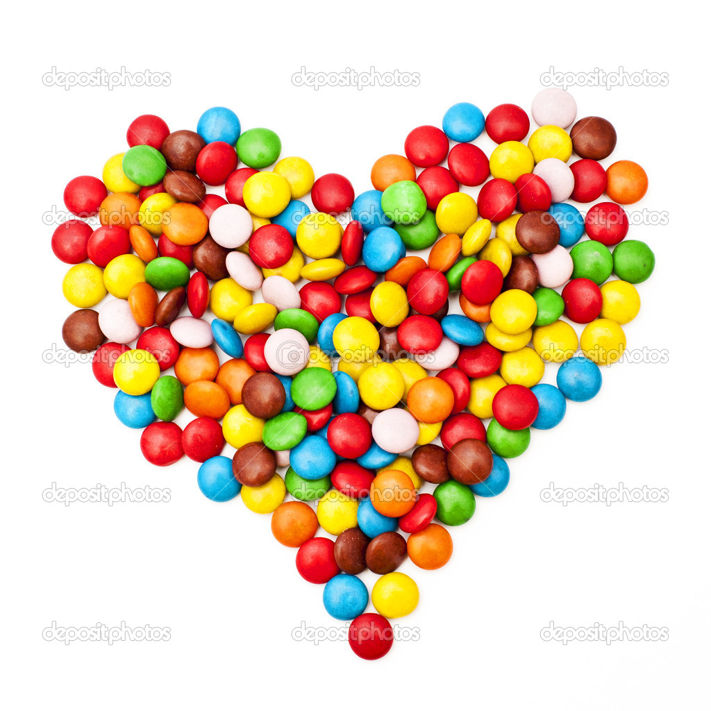 Colorful candy sprinkles heart shape isolated on white