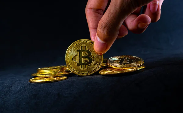 Golden Bitcoin Hand Hold Bitcoin Middle Pile Black Background Ray — Foto de Stock