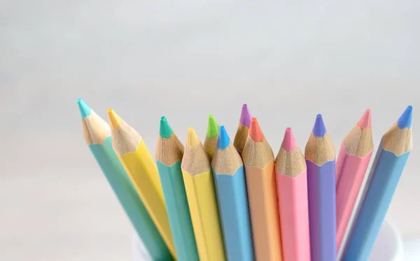 Color pencils, Group of pastel color pencils with white background, Copy space, Close up of Pastel pencil color, Painting equipment concept.