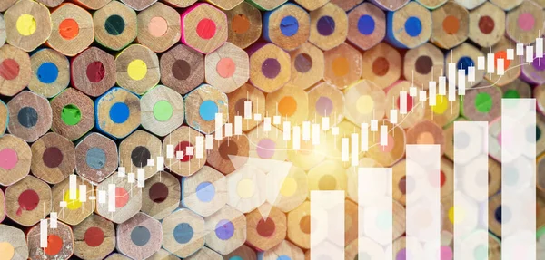 Stacked of crayons with Up arrows, business graphs and charts, Candle stick graph chart of stock market investment trading, Statistic and data, Financial and economy, Business growth concept.