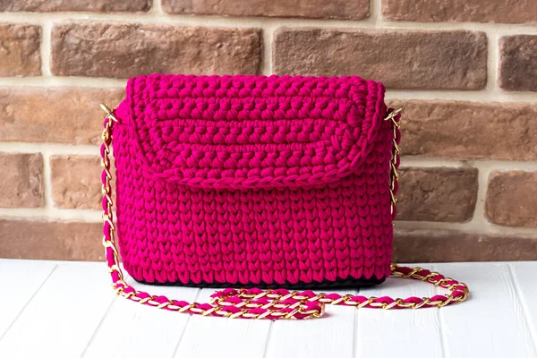 Knitted bag of knitted yarn. Knitted bag of scarlet color