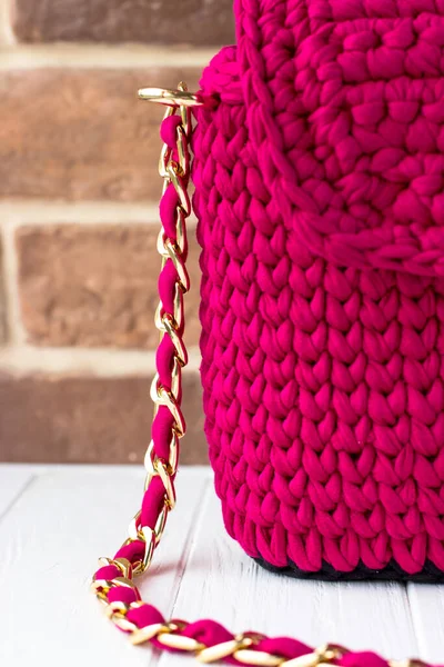 Knitted bag of knitted yarn. Knitted bag of scarlet color
