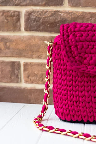 Knitted bag of knitted yarn. Knitted bag of scarlet color