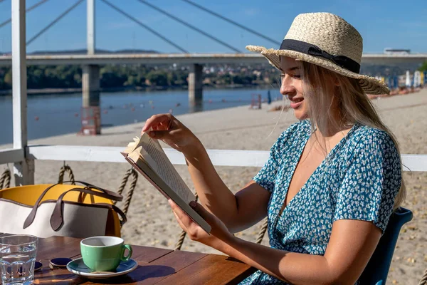 Beautiful Young Woman Wearing Straw Hat Reading Book Enjoying Cup — Stok fotoğraf