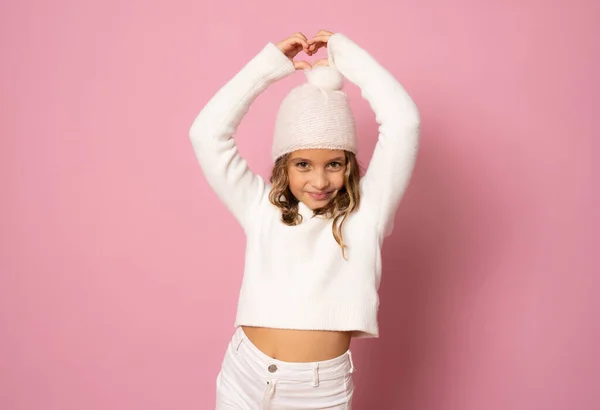 Little Girl White Winter Knitted Hat Sweater Making Heart Figure — Stock Photo, Image