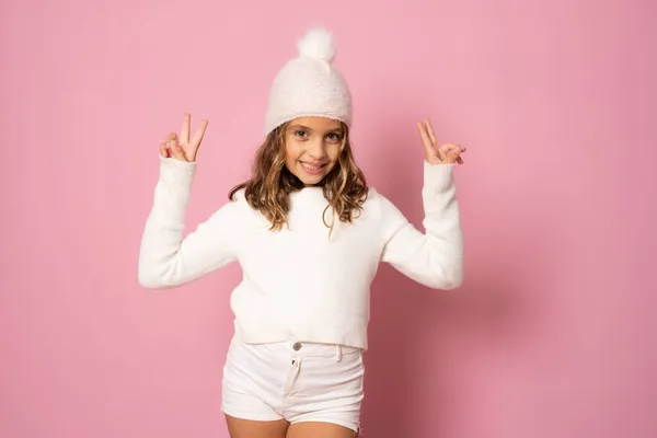 Little Girl White Winter Knitted Hat Sweater Victory Sign Pink — Stock Photo, Image