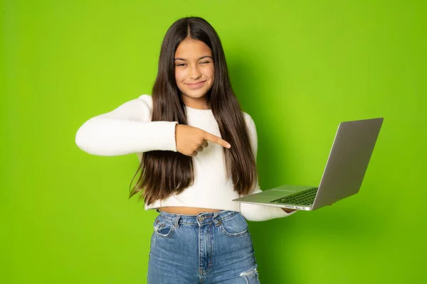 Funny Girl Long Hair Pointing Finger Laptop Computer Green Background — Zdjęcie stockowe