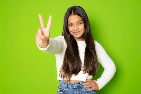 Photo Young Smiling Girl Wearing White Sweater Show Peace Cool — Foto Stock