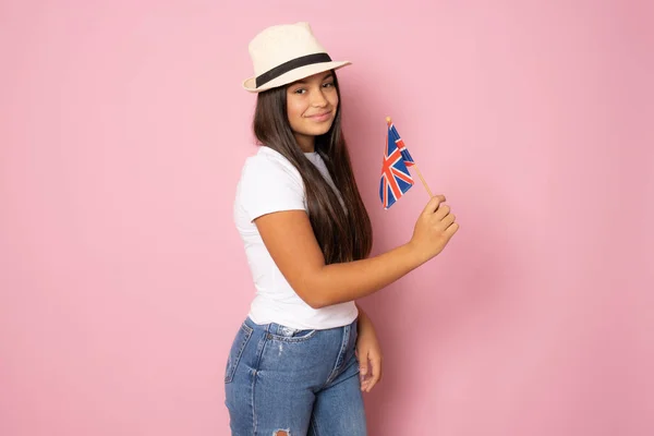 Education Abroad Female Student Holding British Flag Smiling Isolated Pink — Foto Stock