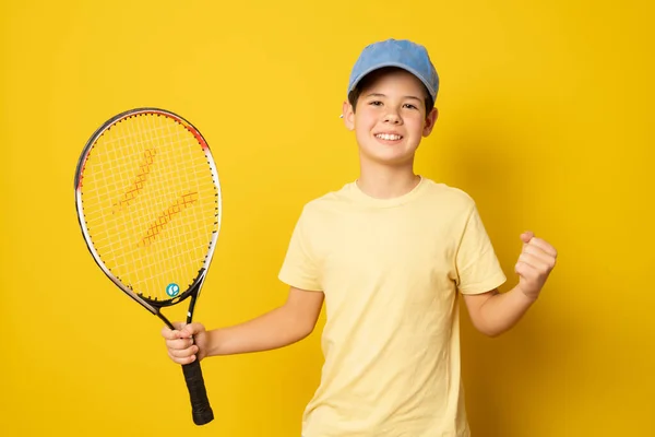 Smiling Boy Playing Tennis Holding Racket Isolated Yellow Background — Zdjęcie stockowe