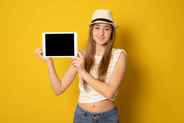 Young Happy Girl Wearing Straw Hat Holding Tablet Computer Isolated — Stock Photo, Image