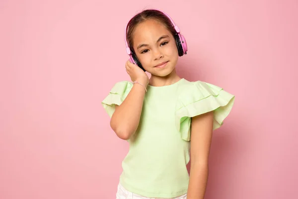 Beautiful Cute Happy Little Girl Headphones Standing Isolated Pink Background — Stok fotoğraf