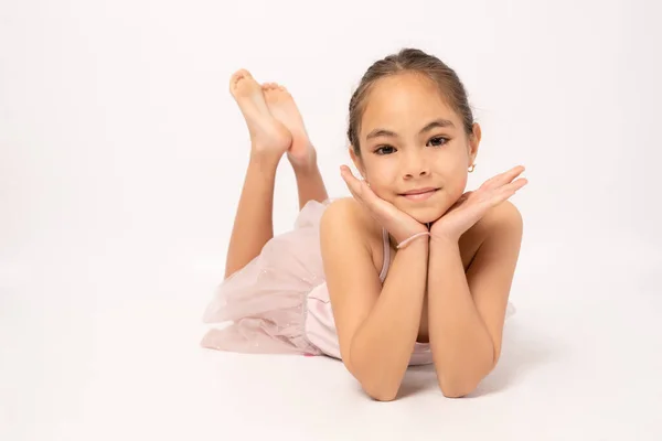 Little Ballerina Girl Laying Ground Posing Camera — стоковое фото