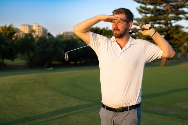 Good Strike Golfer Swinging His Driver Looking Away While Standing — Stok fotoğraf