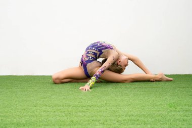 Gymnast doing workout remotely in the terrace at home