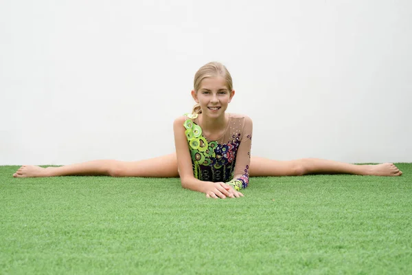Gymnast doing workout remotely in the terrace at home