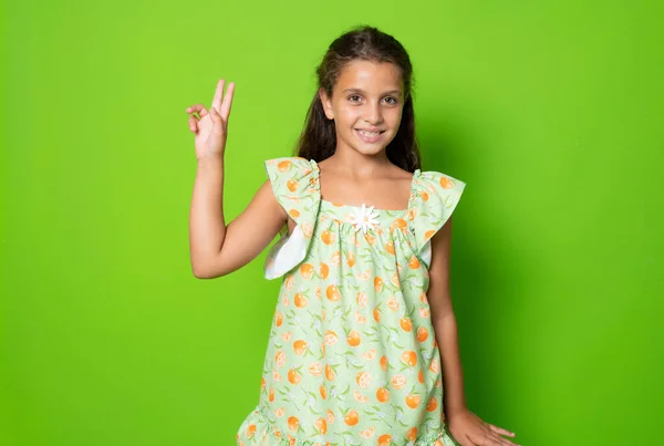 Kid Giving Peace Symbol Fingers Standing Isolated Green Background — Fotografia de Stock