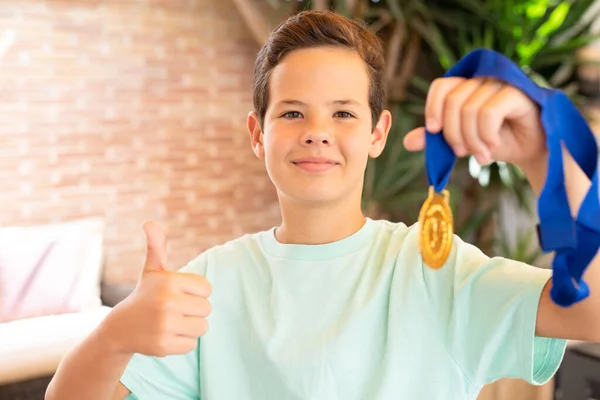Cute Child Boy Showing His Gold Medal Thumb Standing Terrace —  Fotos de Stock