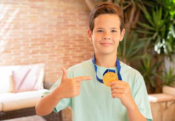 Cute Child Boy Showing His Gold Medal Standing Terrace Home —  Fotos de Stock