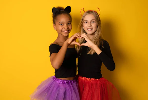 Image Laughing Multinational Girls Black Colorful Halloween Costumes Making Heart — Stock Photo, Image