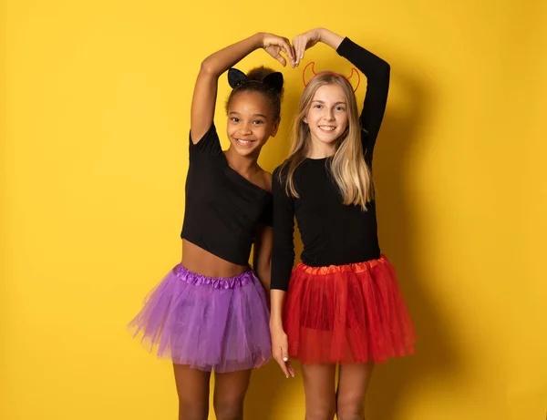 Image Laughing Multinational Girls Black Colorful Halloween Costumes Making Heart — Stock Photo, Image