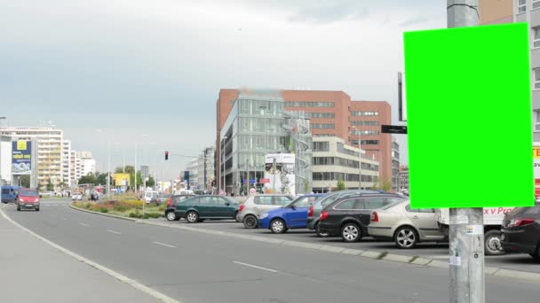 Billboard in the city near road - green screen - buildings,cars and people — Stock Video