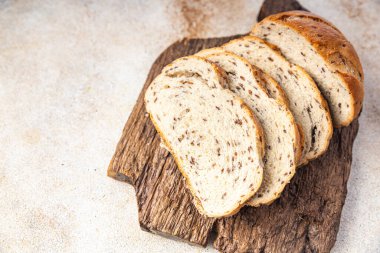 Ekmek keten tohumu fırın ürünleri sağlıklı yemek diyet atıştırmalıkları masanın üzerinde fotokopi alanı arka plan kırsalında. en üstteki görünüm