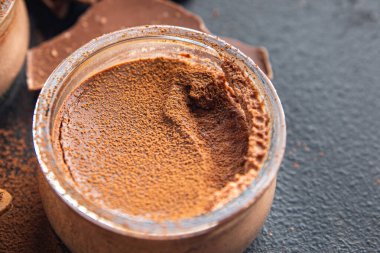 chocolate dessert cream avocado and cocoa powder no dairy, no lactose healthy meal food snack on the table copy space food background rustic top view