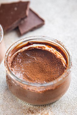 chocolate dessert cream avocado and cocoa powder no dairy, no lactose healthy meal food snack on the table copy space food background rustic top view